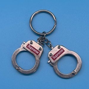 Supreme handcuff key chain